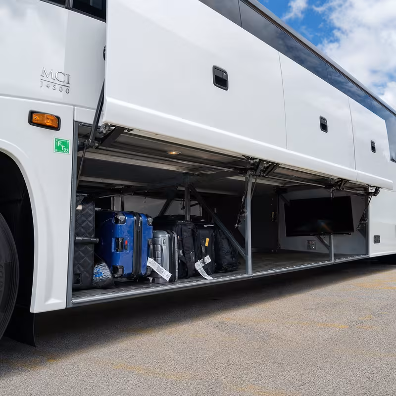 Party bus interior with wraparound leather seating and LED lighting in New Brunswick