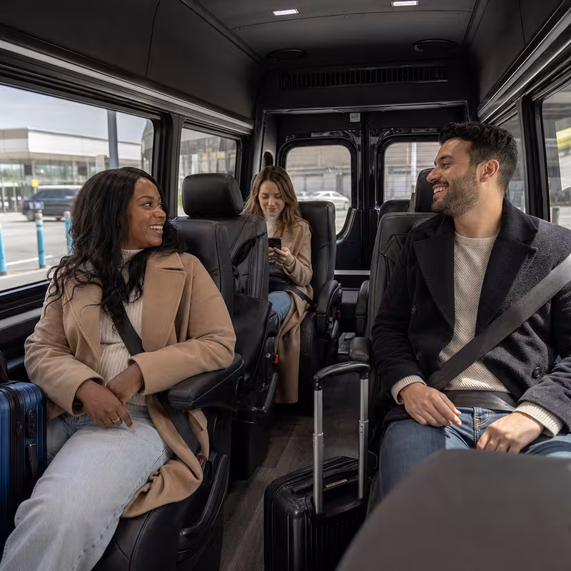 Passengers loading luggage while boarding an New Brunswick group shuttle