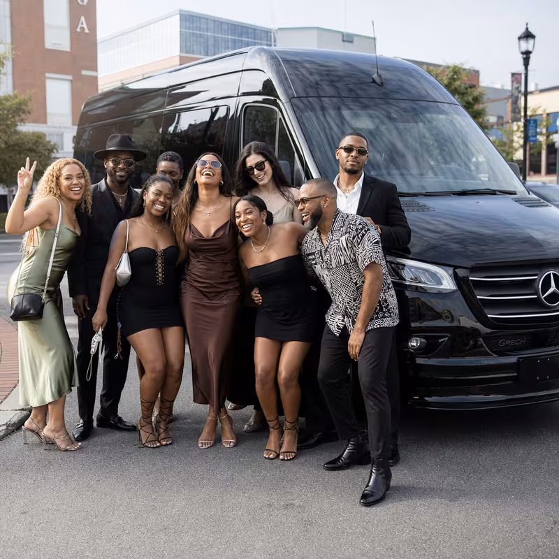 Group boarding a white charter bus for Bachelor & Bachelorette Transportation transportation in New Brunswick