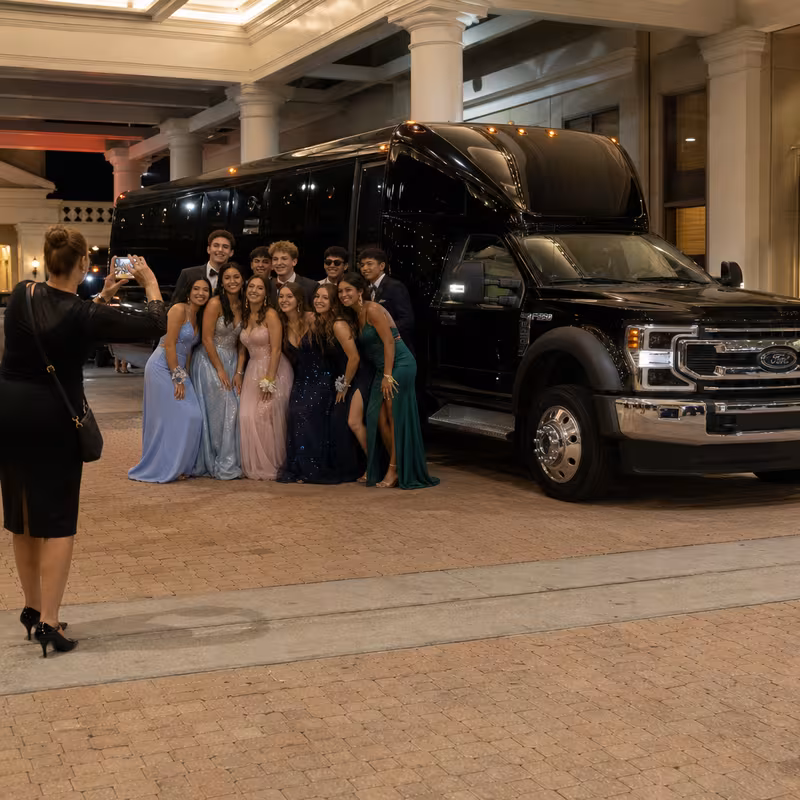 Party bus interior with wraparound leather seating and LED lighting in New Brunswick
