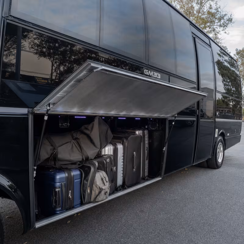 Party bus interior with wraparound leather seating and LED lighting in New Brunswick