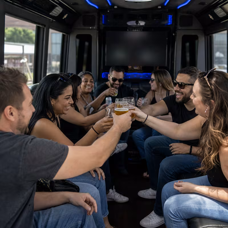 Group boarding a white charter bus for Winery & Brewery Tour Transportation transportation in New Brunswick