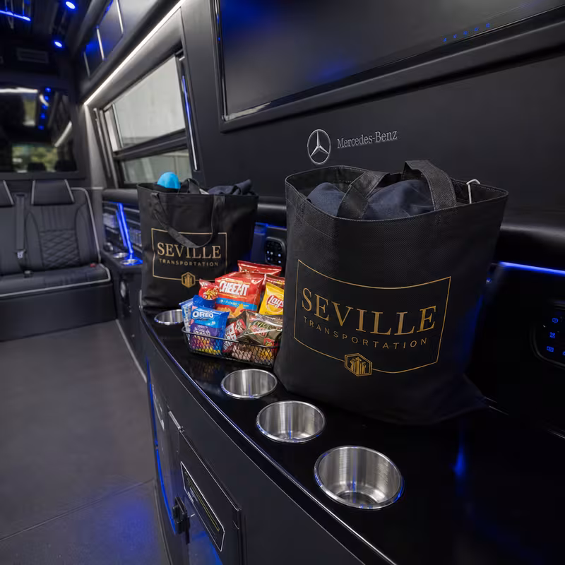 Party bus interior with wraparound leather seating and LED lighting in New Brunswick
